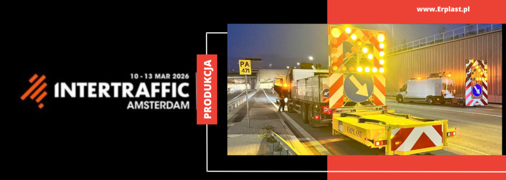 Baner reklamowy targów Intertraffic Amsterdam 2026 oraz sprzętu do zabezpieczenia robót drogowych nocą.